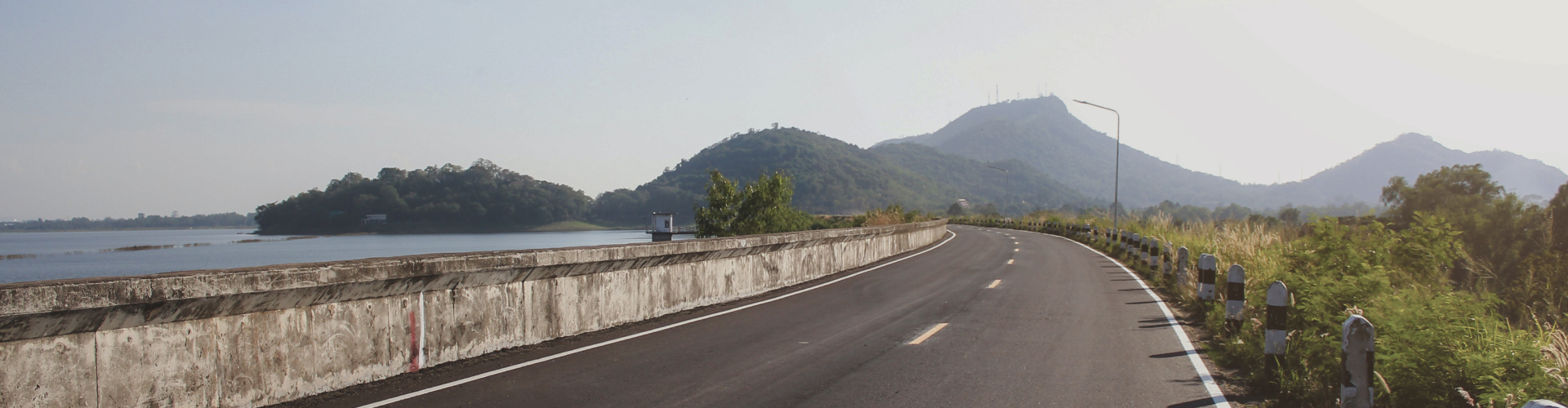 Long shot of a coastal highway with hills in the distance